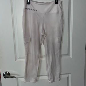Kendall & Kylie white Capri cargo pocket leggings.